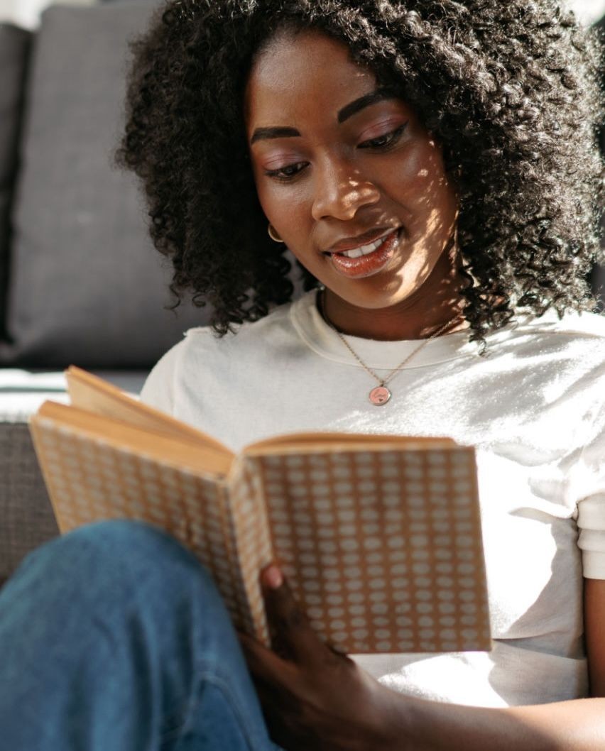 young woman reading a book